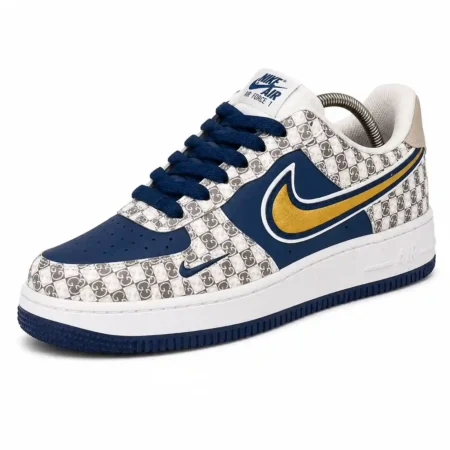 Navy Air Force 1 style sneaker with monogram panels, gold Swoosh detail and white midsole