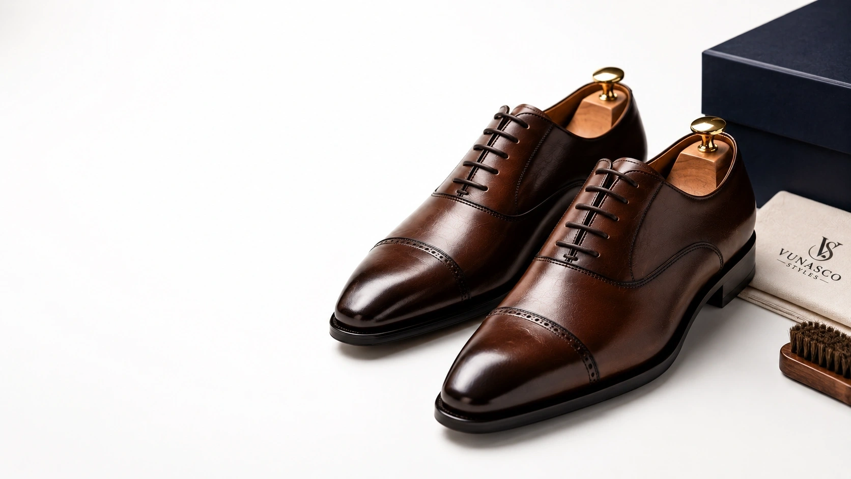 Premium brown leather men's dress shoes displayed in a luxury studio setting.